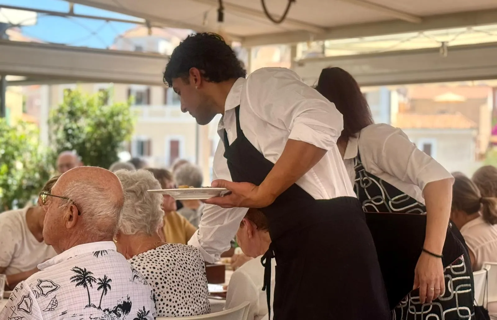 Convivial moment during an event at Perla Blu restaurant